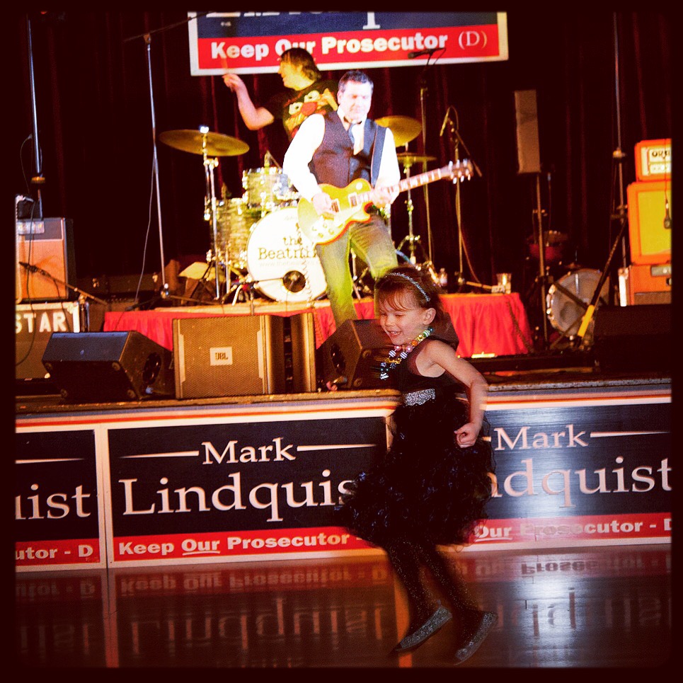 Sloane Lindquist dances to the music of The Beatniks and Peter Buck of R.E.M. at Mark Lindquist fundraiser